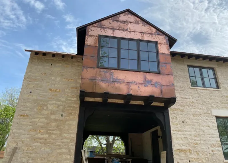 Copper metal panel facade on a stone building for Skylight Installation in Rosemead