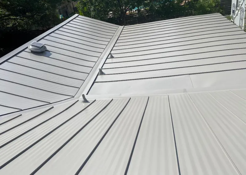 Solar attic fan installed on a metal roof for Roof Ventilation in Rosemead